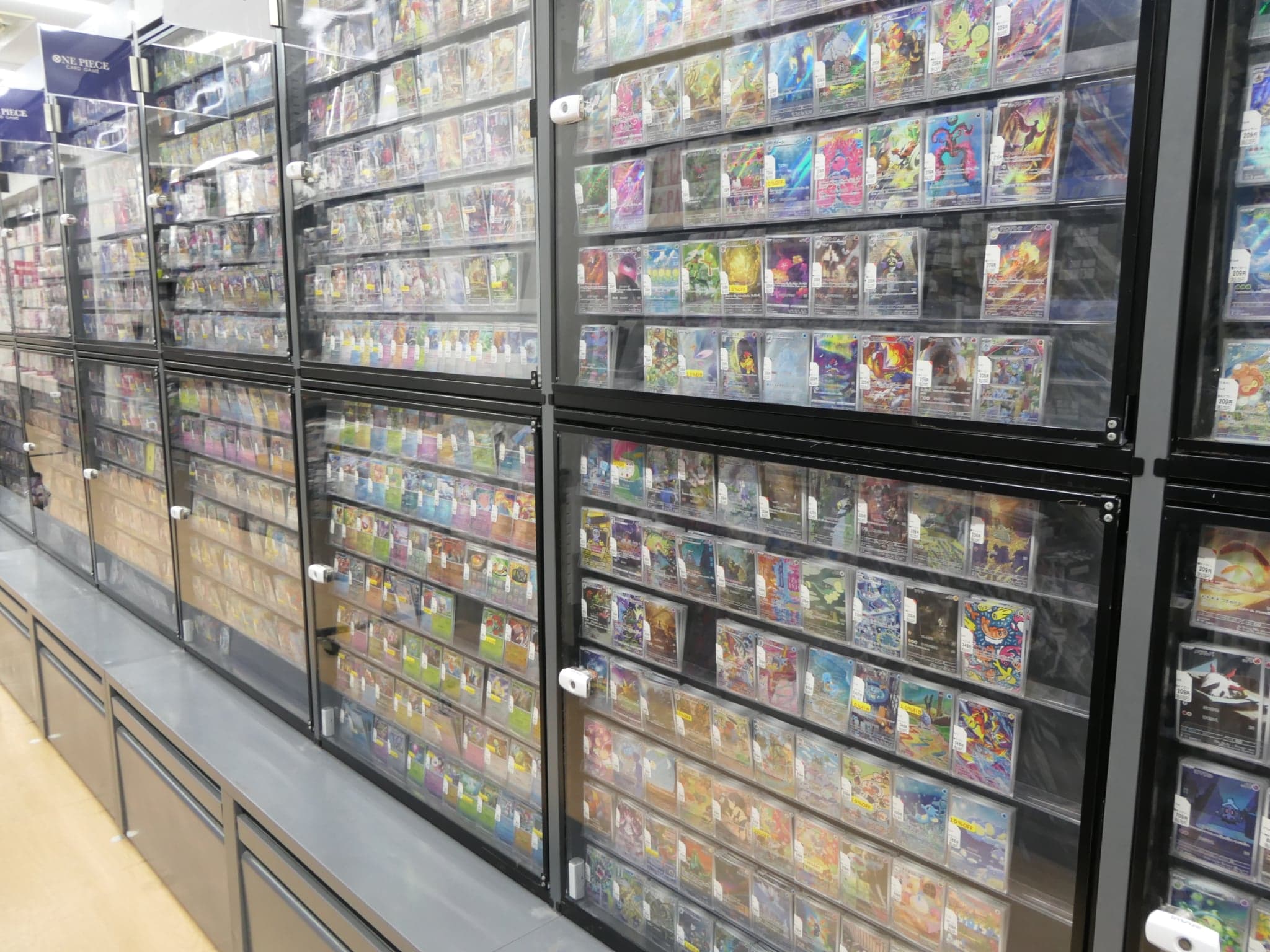 A photo of some rare pokemon cards in a store in Japan.