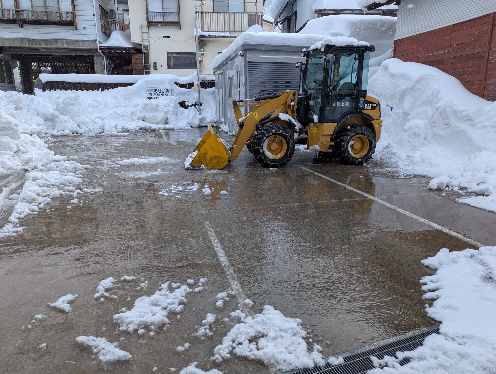Water slowing slowly over a driveway to keep it free of snow.