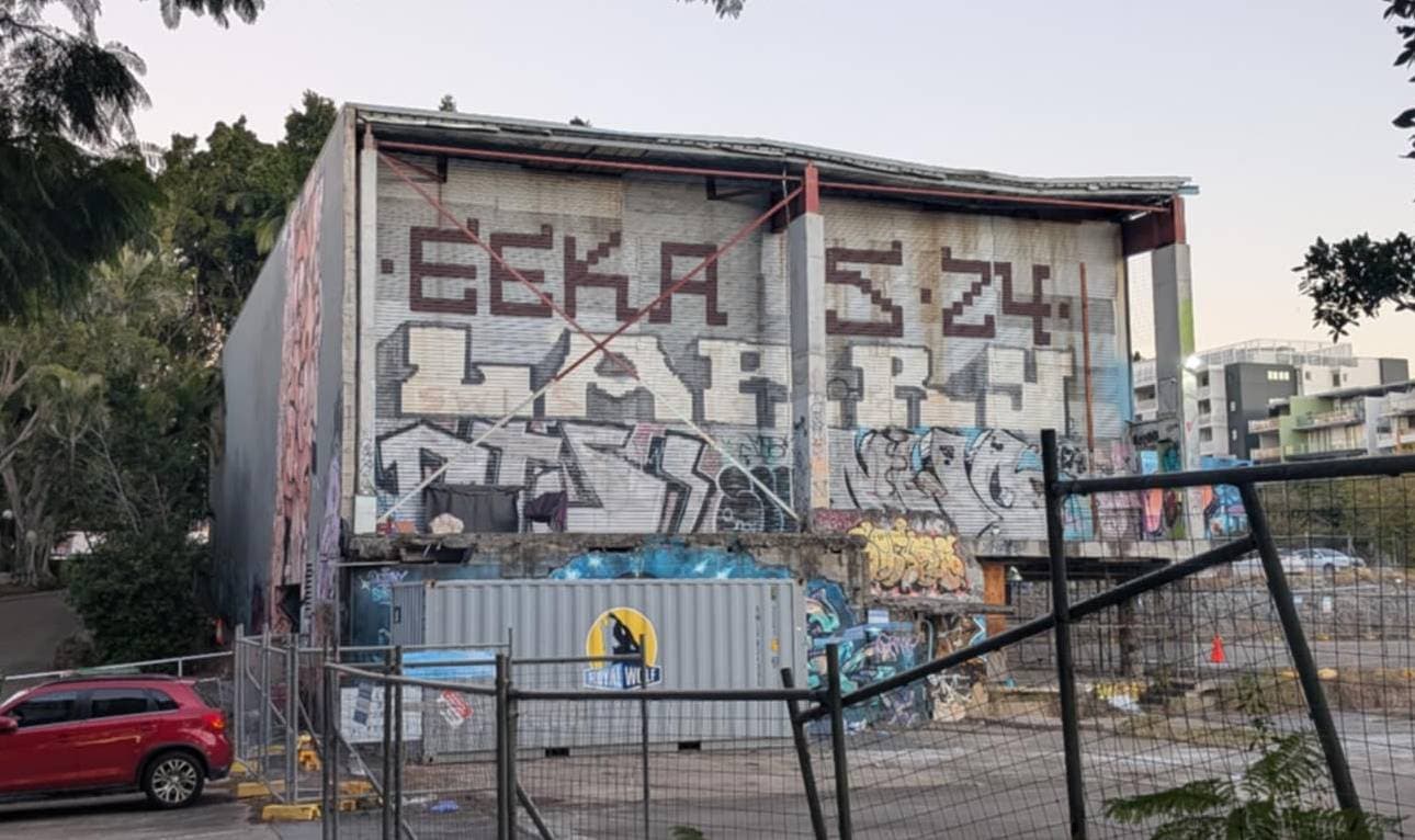 A giant almost pizel-art Eekas on the side of a building.