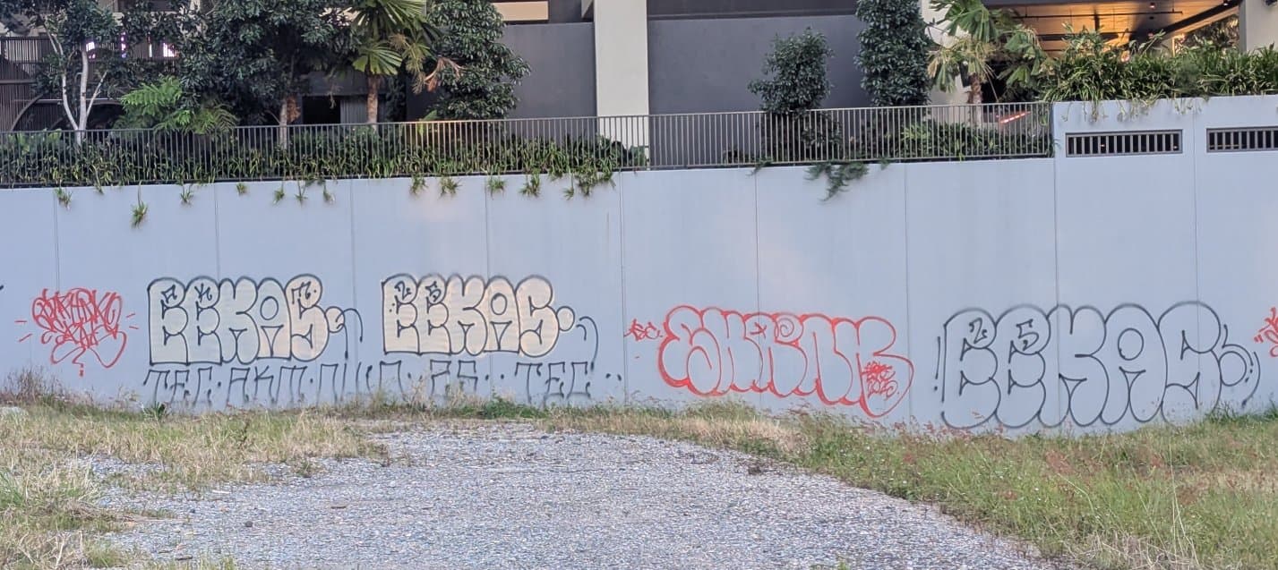 Multiple Eekas tags in big block letters on the side of a building.